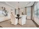 Elegant dining room with modern chandelier, ample natural light from the windows, stylish rug and seating for six at 1059 Antioch Dr, Brookhaven, GA 30319