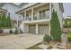 Exterior view of a home featuring a two-car garage and meticulous landscaping at 1059 Antioch Dr, Brookhaven, GA 30319