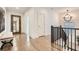 Hallway features hardwood floors, natural light, decorative mirror and accent bench at 1059 Antioch Dr, Brookhaven, GA 30319