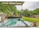 Backyard hot tub oasis featuring landscaping and privacy fencing at 1059 Antioch Dr, Brookhaven, GA 30319