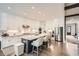 Spacious kitchen featuring an island with bar seating, stainless steel appliances and sleek white cabinetry at 1059 Antioch Dr, Brookhaven, GA 30319