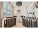 Modern living room featuring neutral walls, stylish furniture, large windows with shades, and eye-catching decorative accents at 1059 Antioch Dr, Brookhaven, GA 30319