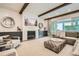 Comfortable living room features a fireplace, built-in cabinets, and a large sectional sofa at 1059 Antioch Dr, Brookhaven, GA 30319