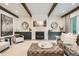 Bright living area features wooden beams, a modern fireplace, and comfortable seating at 1059 Antioch Dr, Brookhaven, GA 30319