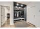 Mudroom area with bench, storage baskets, coat hooks, and shoe storage at 1059 Antioch Dr, Brookhaven, GA 30319