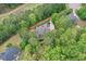 Aerial view of the home, surrounded by mature trees, with a long driveway from the main road at 176 Nightwind Trce, Acworth, GA 30101