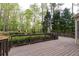 Large backyard deck with decorative railing and peaceful wooded view at 176 Nightwind Trce, Acworth, GA 30101