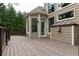 Spacious wooden deck with multiple access points to the home's interior at 176 Nightwind Trce, Acworth, GA 30101
