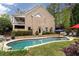Beautiful backyard pool with manicured lawn and inviting lounge chairs at 176 Nightwind Trce, Acworth, GA 30101
