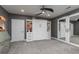 Neutral toned carpeted bedroom features a ceiling fan, built-in shelving, and mirrored closet at 176 Nightwind Trce, Acworth, GA 30101
