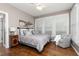 Bright bedroom with hardwood floors, large windows, and comfortable seating area at 176 Nightwind Trce, Acworth, GA 30101