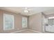 Empty bedroom featuring plush carpeting, natural light, and adjacent bathroom at 176 Nightwind Trce, Acworth, GA 30101