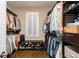 Organized walk-in closet with custom shelving and storage solutions at 176 Nightwind Trce, Acworth, GA 30101