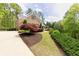 A charming home with a well-manicured lawn and mature landscaping around the property at 176 Nightwind Trce, Acworth, GA 30101
