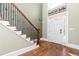 Grand foyer with hardwood floors, staircase with wrought iron, and high ceilings for a luxurious entrance at 176 Nightwind Trce, Acworth, GA 30101