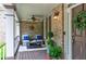 Relaxing front porch featuring comfortable seating, decorative accents, and views of the surrounding greenery at 176 Nightwind Trce, Acworth, GA 30101
