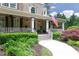 Inviting front porch with comfortable seating, charming decor, and a view of the well-manicured front yard at 176 Nightwind Trce, Acworth, GA 30101