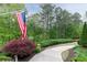 Well-maintained yard with sidewalk leading to the house and an American flag at 176 Nightwind Trce, Acworth, GA 30101