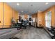 Large basement gym with modern equipment, wood paneled walls, and vinyl floor at 176 Nightwind Trce, Acworth, GA 30101