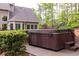 Backyard patio featuring a relaxing hot tub, perfect for unwinding after a long day at 176 Nightwind Trce, Acworth, GA 30101