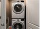 Modern laundry room with stacked washer and dryer at 176 Nightwind Trce, Acworth, GA 30101