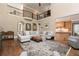 Spacious living room with soaring ceilings, hardwood floors, and a second-story balcony at 176 Nightwind Trce, Acworth, GA 30101