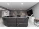 Beautiful finished basement living room with sleek gray walls and carpet at 176 Nightwind Trce, Acworth, GA 30101