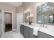 The main bathroom features grey cabinets, a double sink, large mirror, and a glass shower at 176 Nightwind Trce, Acworth, GA 30101