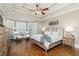 The main bedroom features hardwood floors, large windows, decorative ceilings, and a sitting area with comfortable furniture at 176 Nightwind Trce, Acworth, GA 30101