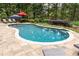 Private pool with patio area featuring shade umbrellas, lounge chairs, and well-manicured landscaping at 176 Nightwind Trce, Acworth, GA 30101