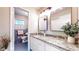 Charming bathroom featuring a granite vanity, two decorative mirrors and access to the toilet area at 2735 Shetland Dr, Decatur, GA 30033