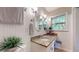 Bright bathroom with wainscotting, granite countertop, and decorative oval mirrors at 2735 Shetland Dr, Decatur, GA 30033