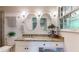 Charming bathroom with granite countertop, dual mirrors and beadboard walls at 2735 Shetland Dr, Decatur, GA 30033