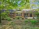 Charming brick home nestled among lush greenery and a beautifully landscaped front yard at 2735 Shetland Dr, Decatur, GA 30033
