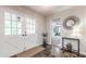 Inviting foyer with double glass doors, slate flooring, and stylish decor, leading into the home's living spaces at 2735 Shetland Dr, Decatur, GA 30033