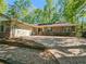 Charming brick home featuring an attached two-car garage, well-maintained landscaping, and a brick paver driveway at 2735 Shetland Dr, Decatur, GA 30033