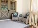 Charming front porch with wicker chairs and patterned pillows, complemented by stylish double doors at 2735 Shetland Dr, Decatur, GA 30033
