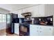 Charming kitchen with white cabinets, dark appliances and stone countertops at 2735 Shetland Dr, Decatur, GA 30033