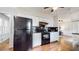 The kitchen features a black oven and refrigerator with lots of storage at 2735 Shetland Dr, Decatur, GA 30033