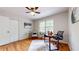 Inviting office with hardwood floors, natural lighting, and a well-appointed desk and chair at 2735 Shetland Dr, Decatur, GA 30033