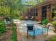 Inviting brick patio with comfortable seating, vibrant greenery, perfect for enjoying the outdoors at 2735 Shetland Dr, Decatur, GA 30033