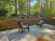 Charming outdoor brick patio with comfortable seating, surrounded by lush greenery and privacy at 2735 Shetland Dr, Decatur, GA 30033