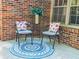 Cozy outdoor seating on brick patio, with garden view, an ideal space for relaxation or entertaining at 2735 Shetland Dr, Decatur, GA 30033