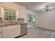 Eat-in kitchen featuring stainless steel appliances, granite counters, and a sliding door to the outdoor deck at 6454 Boca Grande Blvd, Forest Park, GA 30297