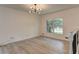 Bright living room showcasing wood floors, fresh white walls, and large window at 6454 Boca Grande Blvd, Forest Park, GA 30297