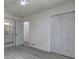 Main bedroom boasts wood floors, a closet, and an ensuite bathroom with a modern aesthetic at 6454 Boca Grande Blvd, Forest Park, GA 30297