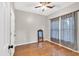 Inviting bedroom with wood floors, ceiling fan, and ample natural light, offering a serene atmosphere at 898 Allene Sw Ave, Atlanta, GA 30310