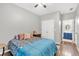 Spacious bedroom featuring wood floors, closet doors, and an ensuite bathroom at 898 Allene Sw Ave, Atlanta, GA 30310