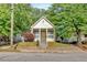 Charming front exterior view of the house featuring a yellow front door and a cozy front porch at 898 Allene Sw Ave, Atlanta, GA 30310
