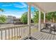 A view from the front porch with white railings and pillars, offering a look at the street at 898 Allene Sw Ave, Atlanta, GA 30310